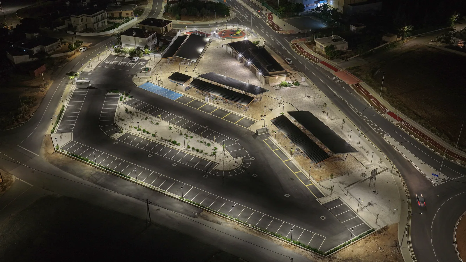 Solar-powered LED lighting illuminating Deryneia public market at night