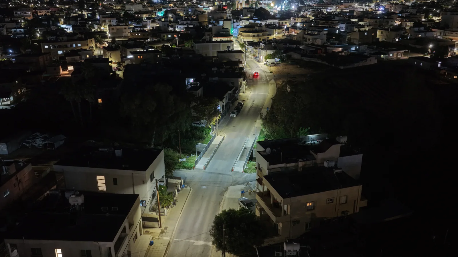 Modern lighting installation on the mixed-use bridge in Paralimni at dusk